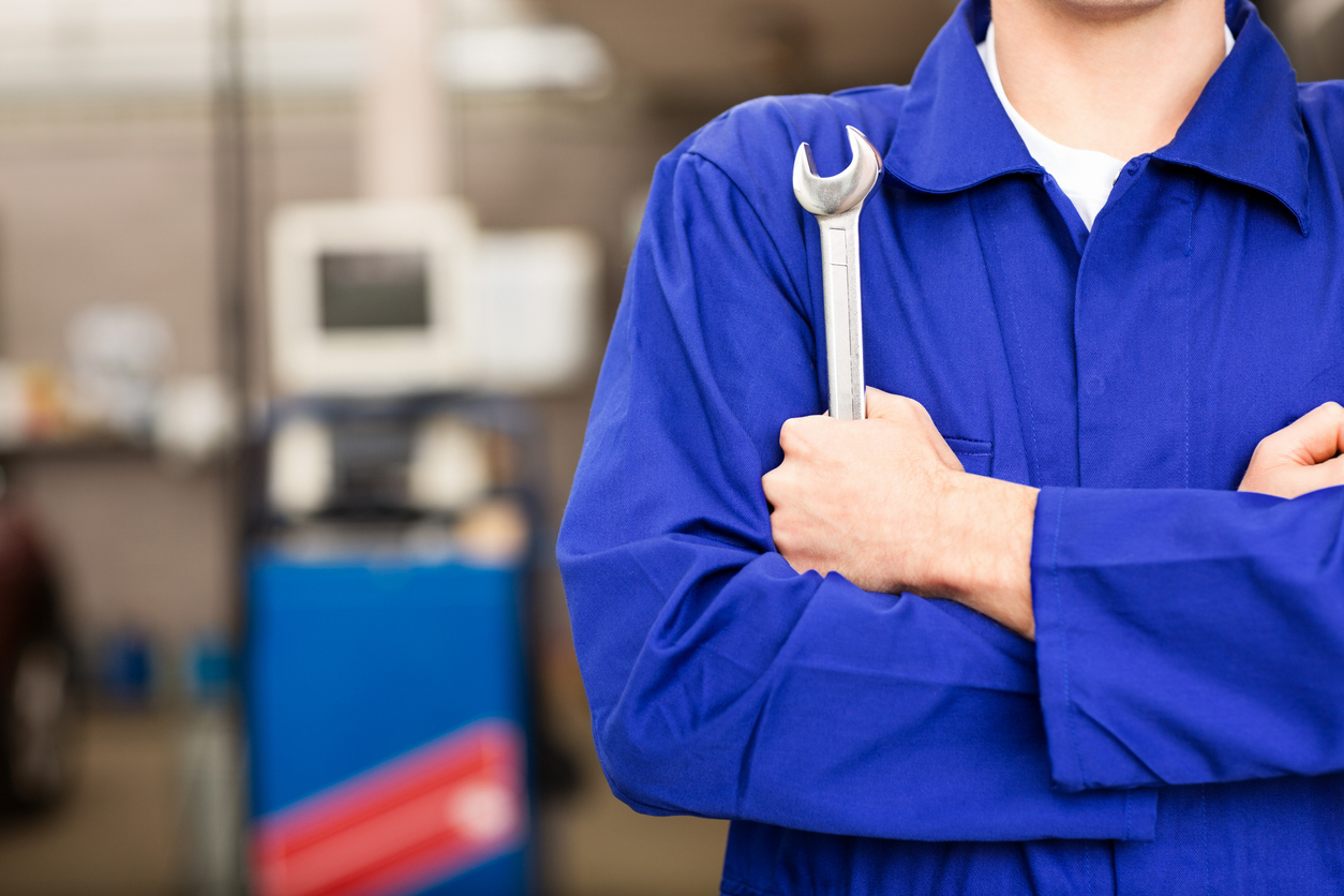 Mechanic Holding Wrench